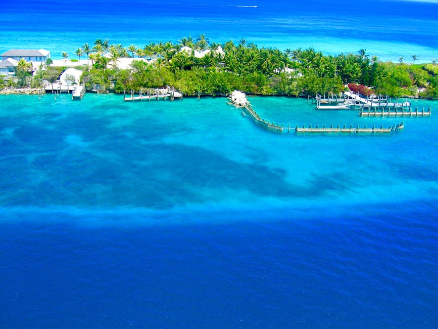 A breathtaking aerial view of Nassau, Bahamas showcasing vibrant blue waters and lush greenery.